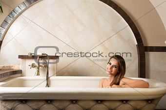 smiling girl in a bathtub 