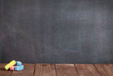 Colorful chalks on classroom table