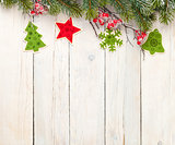 Christmas wooden background with fir tree and decor