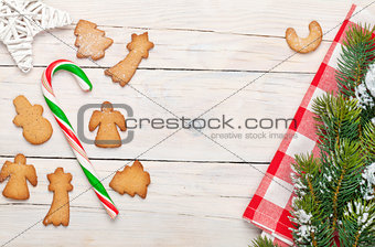 Christmas background with candy cane, gingerbread cookies and sn