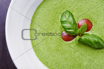 Gazpacho spinach with basil leaves and tomatoes