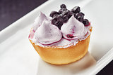 Beautiful cream Cupcake dessert with blackberry