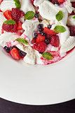 delicious ice cream with berries and pieces of meringue