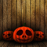 3D grunge Halloween jack o lanternS on a wooden background
