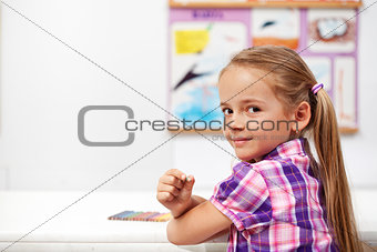 Young girl in science class