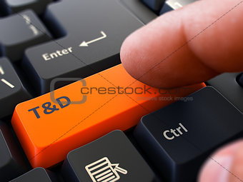 Pressing Orange Button T and D on Black Keyboard.