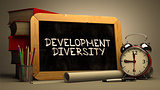 Handwritten Development Diversity on a Chalkboard.