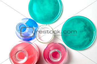 Laboratory glassware with liquids of different colors