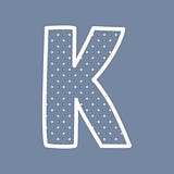 K vector alphabet letter with white polka dots on blue background