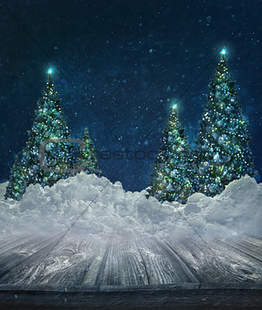 Holiday background with Christmas trees in snow