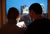 Couple Using Tablet PC in the Evening