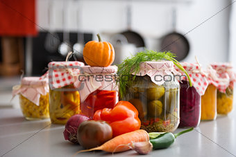 Closeup of preserved vegetables in glass jars