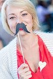 Woman with fake mustache.
