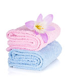 Pink and blue towels and flower