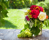 Bunch of garden flowers and grape