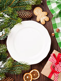 Christmas tree branch, empty plate and coffee