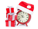 Christmas clock, gift boxes and santa hat