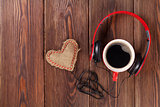 Heart toy with headphones and coffee cup