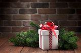 Christmas gift box and tree branch