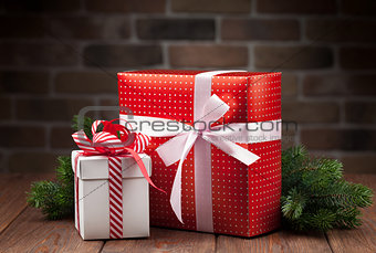Christmas gift boxes and tree branch