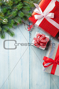 Christmas gift boxes and tree branch