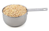 Pearl barley in a measuring cup