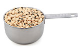Black eyed peas in a measuring cup