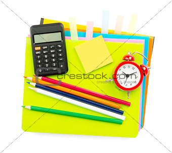 Crayons and alarm clock with stickers