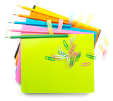 Crayons with clips on copybooks