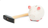 Piggy bank with hammer, close up view