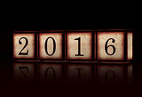 new year 2016 in 3d wooden cubes over black background