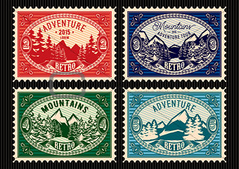 stamps with fir forest and mountains