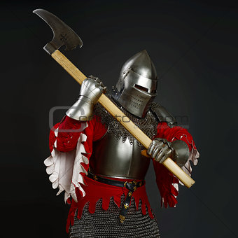 Medieval knight with an axe  on grey background