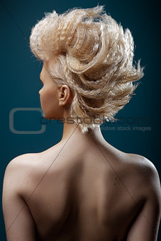 Beautiful young woman with short  haircut  on studio background