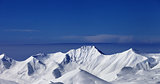 Panoramic view on off-piste snowy slope at nice sunny day
