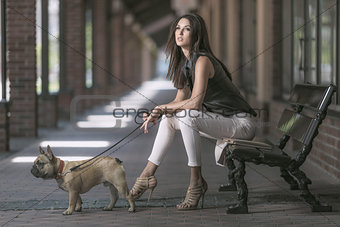 brunette woman sitting with dog