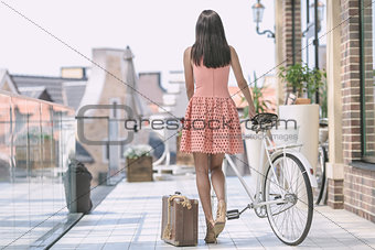 brunette woman with bicycle
