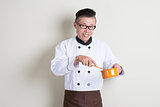 Mature Asian Chinese chef cooking