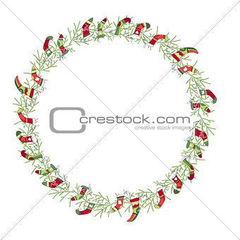 Round Christmas wreath with Santa socks isolated on white.