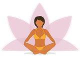 Woman is doing yoga and sitting in the lotus position