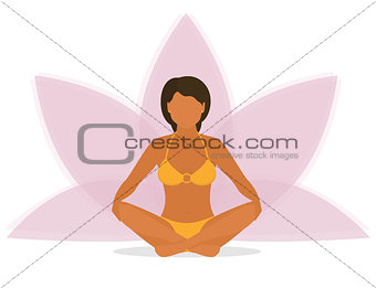 Woman is doing yoga and sitting in the lotus position