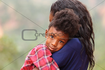 Child Hugging Mother