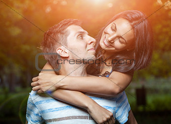 Happy couple embracing in the park