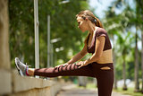 Woman Doing Stretching Before Sports Training At Morning-3