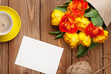 Colorful tulips, greeting card and coffee