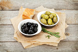 Italian food appetizer of olives, bread and herbs