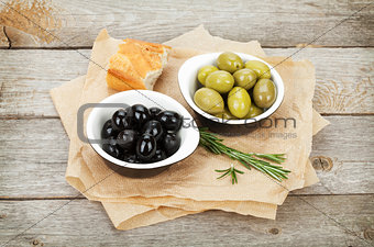 Italian food appetizer of olives, bread and herbs