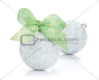 Christmas baubles and green ribbon