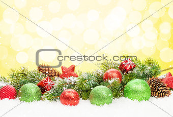 Christmas tree and bauble decor on snow