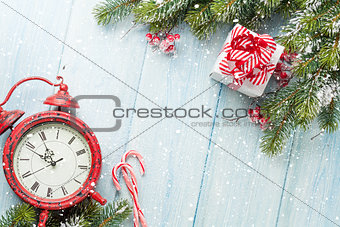 Christmas gift box, alarm clock, candy cane and fir tree